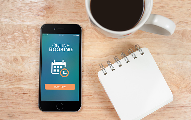 What are some common challenges faced when implementing an online booking system?