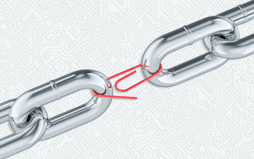 2 links of a chain held together by a paper clip. Weak link concept