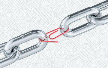 2 links of a chain held together by a paper clip. Weak link concept