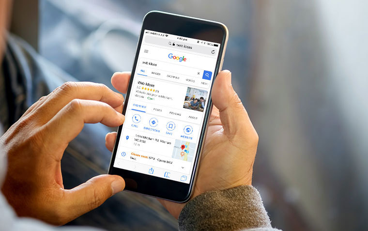 Man looking at Web Ideas' Google My Business Page