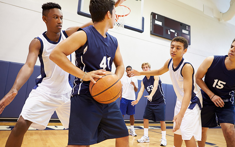 Players on college basketball court